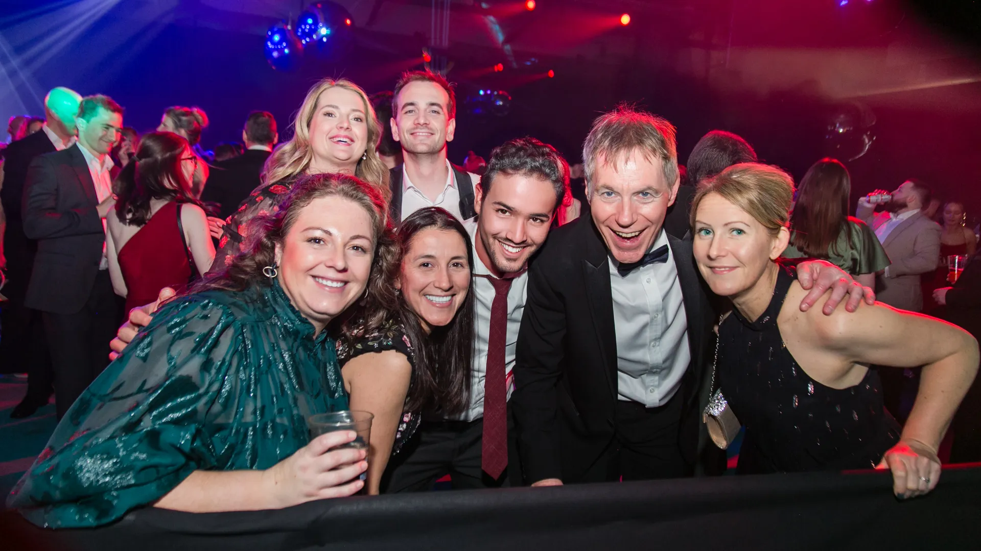 Staff smiling at corporate event disco